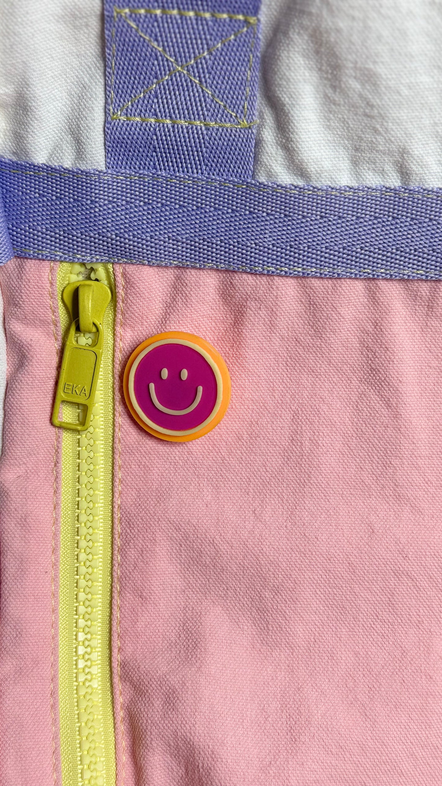 Happy face pin