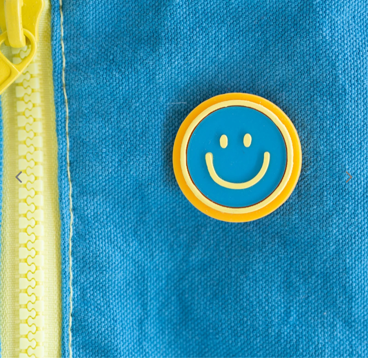 Happy face pin