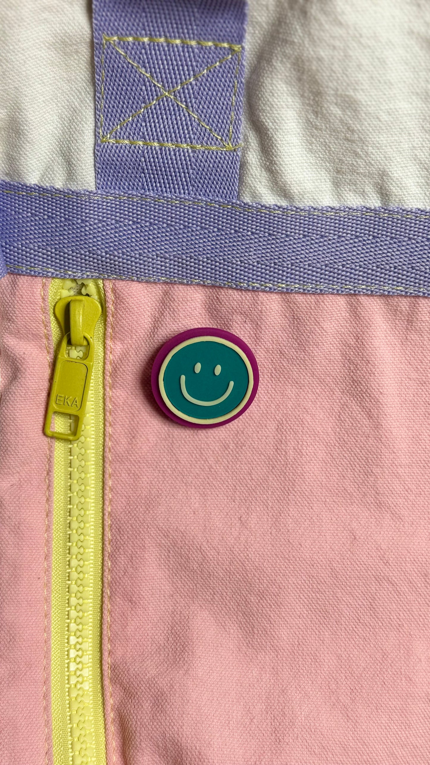 Happy face pin