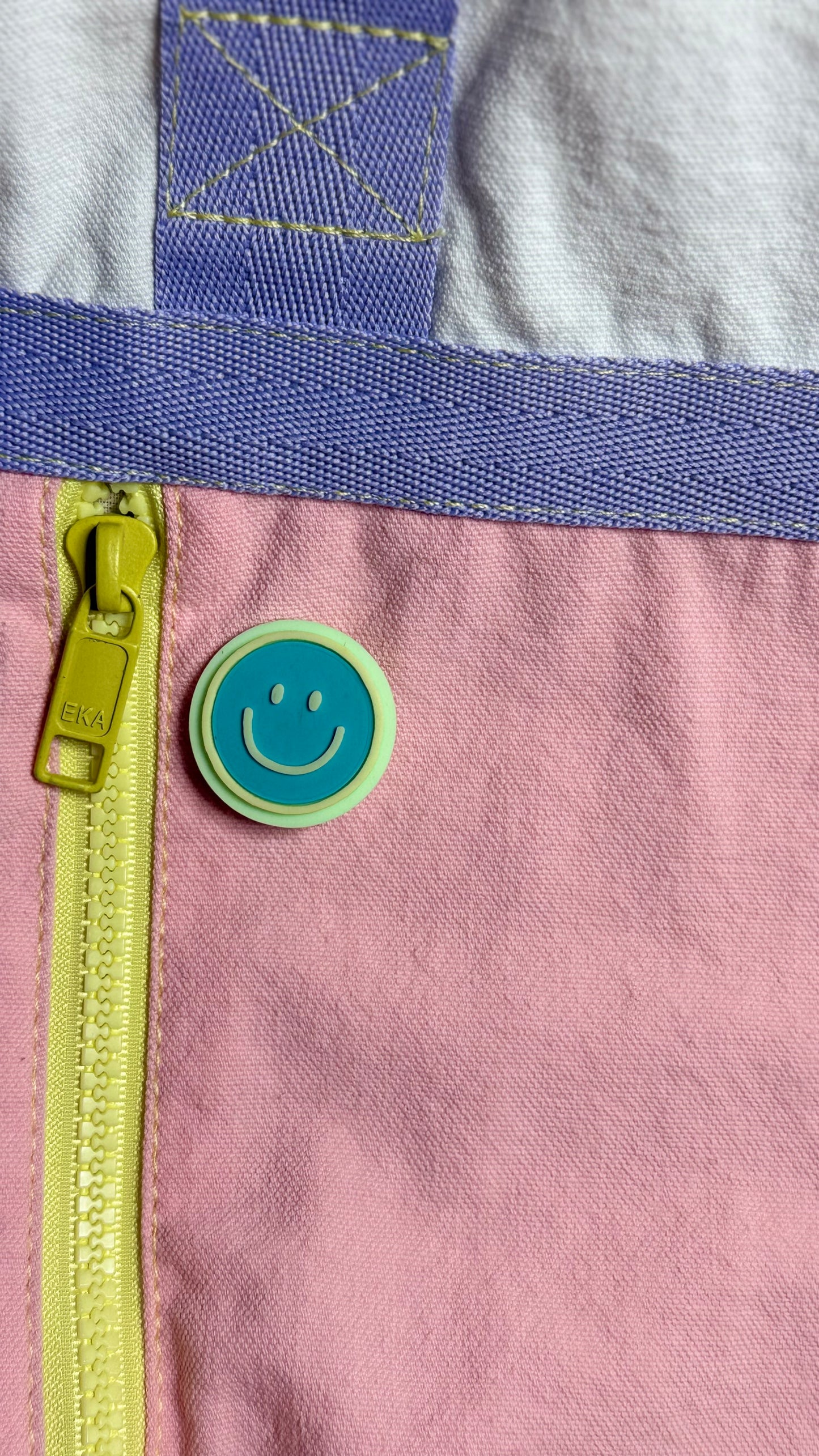Happy face pin